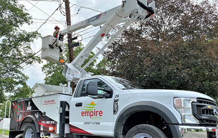 A white pick-up truck branded with the 